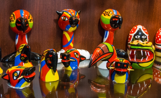 Hand painted local birds and totems at Artesanias de Colombia in El Centro (Old City) Cartagena, Colombia
