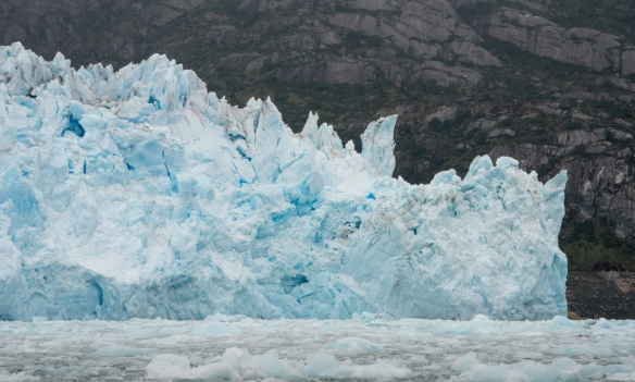 The glacier (solid ice and snow) literally flowing down into the Pacific Ocean; Amalia (or Skua) Glacier, Amalia Sound, Bernardo O´Higgins National Park, Patagonia, Chile