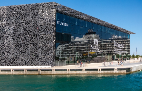 Our ship reflected in the glass façade of MuCEM – Musee des Civilisations de l’Europe et de la Mediterranee (modern art museum), Marseille, France